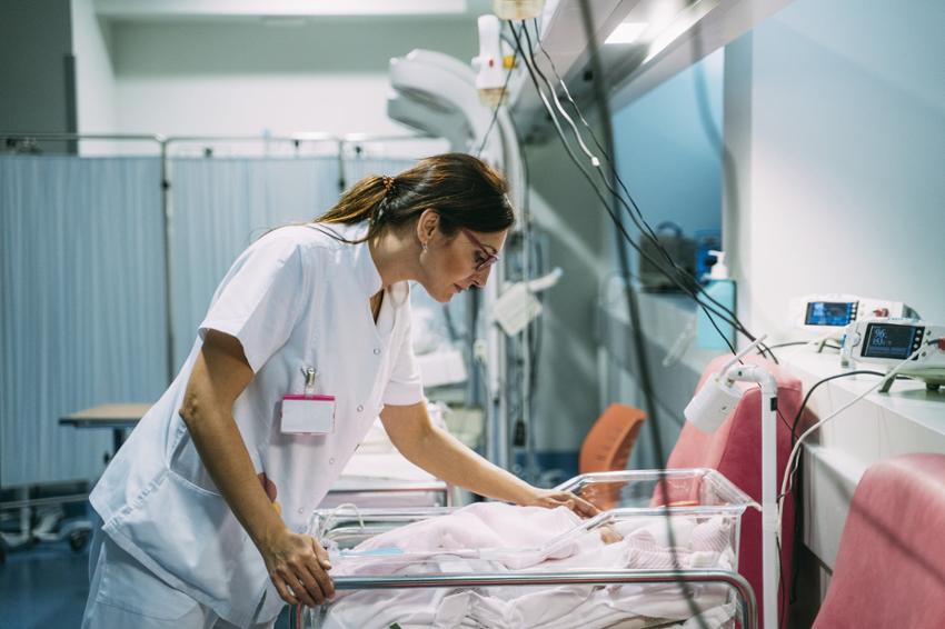 Nurse checking on neonatal patient